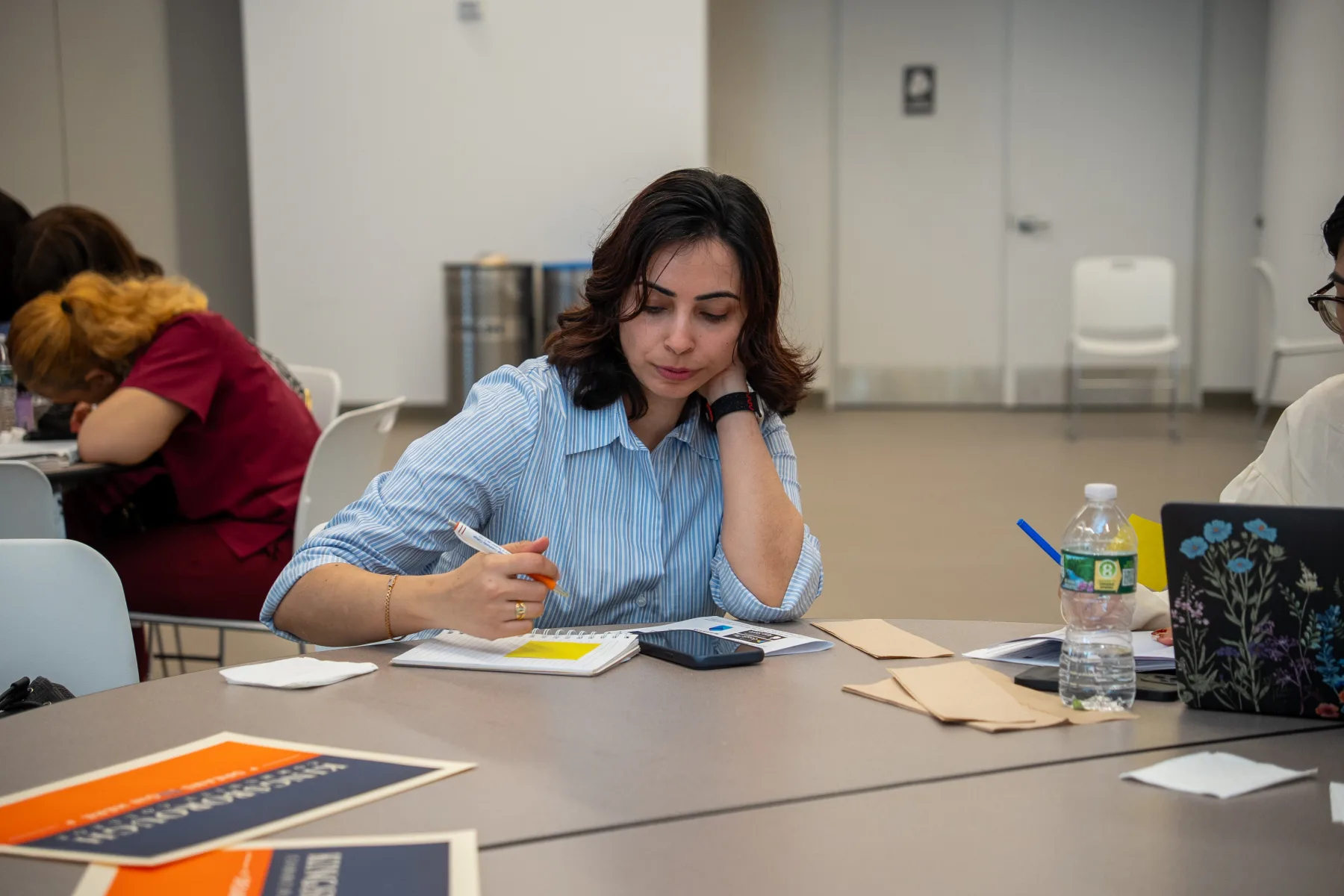 An Uplift participant concentrating during a workforce learning session